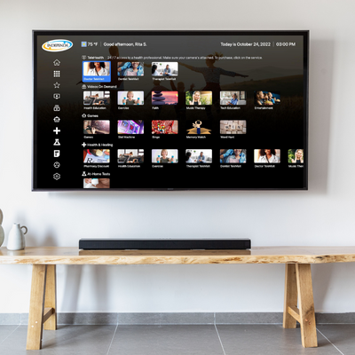 Independa Health Hub displayed on a wall-mounted smart TV in a living room